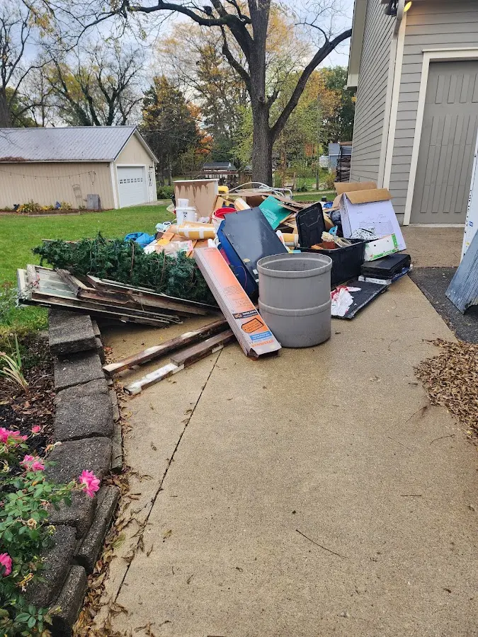 Dumpster being loaded with debris for Estate Cleanout Dumpster Rental in Citrus Hills